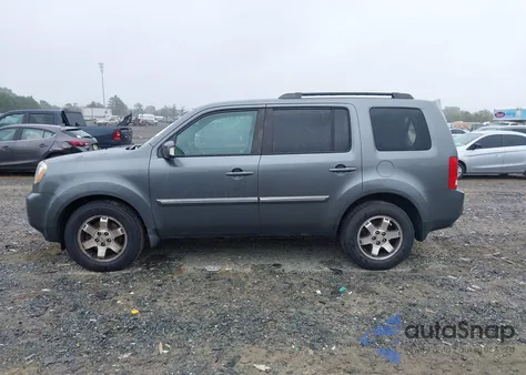 2011 Honda Pilot Touring z USA, uszkodzony, nr VIN 5FNYF4H92BB035672